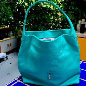 Mint condition Dooney & Bourke aqua leather bag with coin purse.